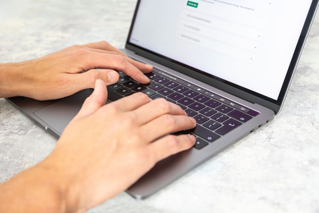 Typing on a laptop